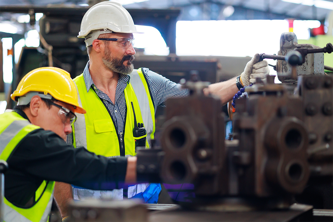 Factory worker involved in production as part of end to end supply chain design for reshoring