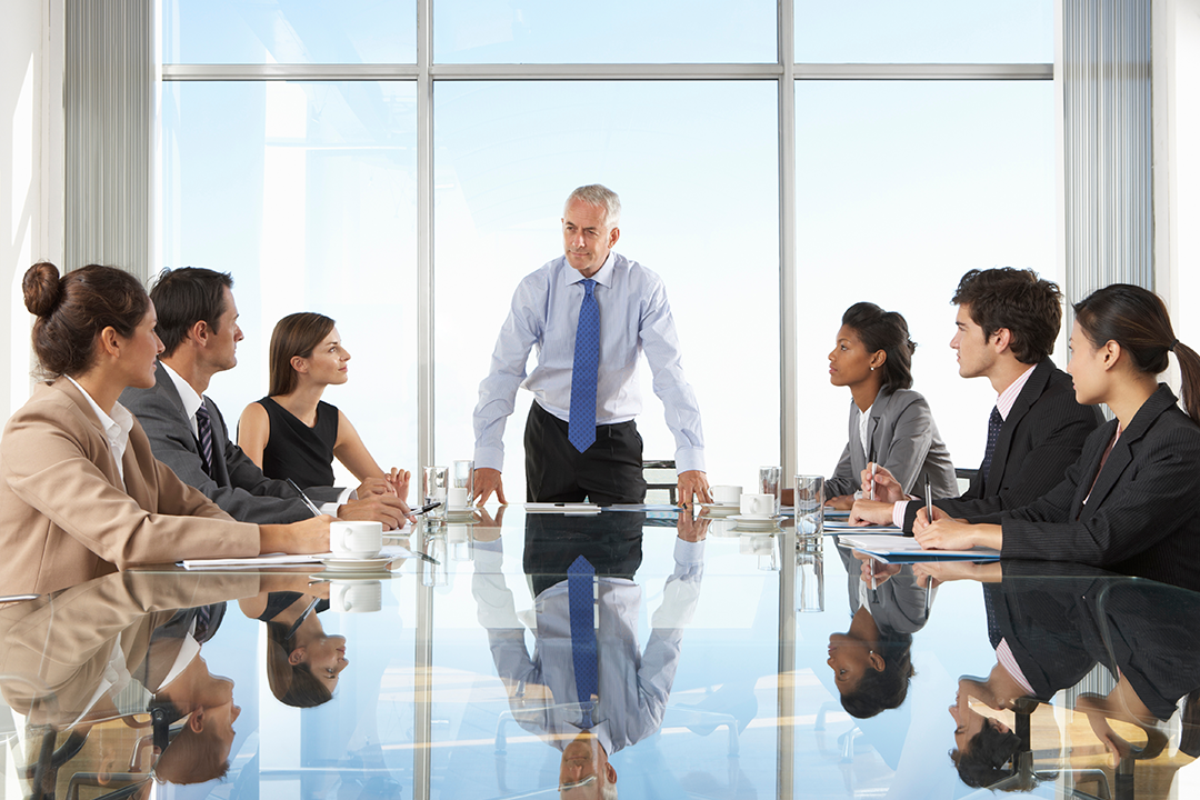 Leadership meeting reviewing the strategic power and competitive advantages of end to end procurement