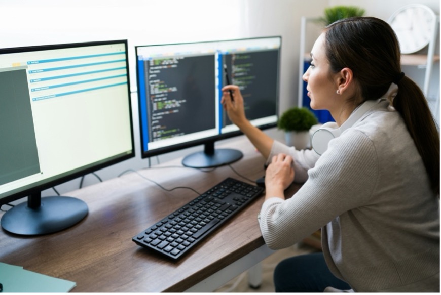 Supply chain manager using procurement software to automate tasks and enhance procurement process improvement.