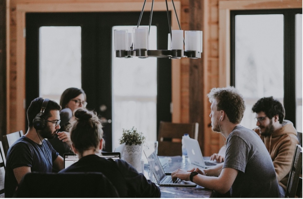 Team meeting discussing suppliers and strategies for supplier relationship management to drive procurement process improvement.